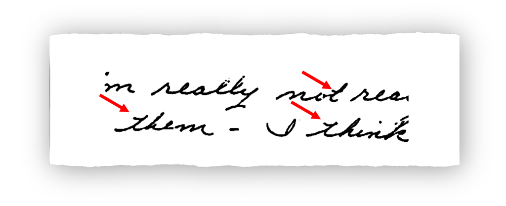 A close-up view of a handwritten phrase highlighting specific traits with red arrows, showcasing the nuances of handwriting.